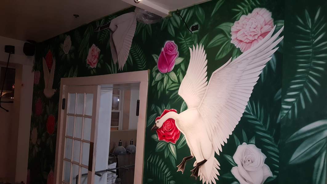 Mural Art of Geese at Duck Duck Goose Restaurant in Baltimore Maryland.